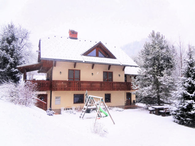 Exterior of Apartments Valant Bled covered in snow in winter