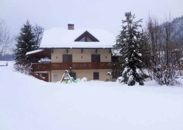 Exterior of Apartments Valant Bled in Slovenia covered with a layer of snow in winter