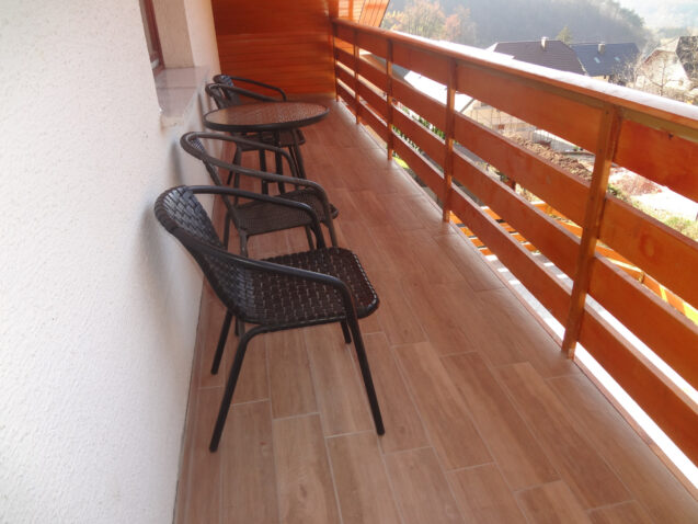 West-facing balcony of Superior Apartment With 3 Balconies with brand new slip-resistant tiles that mimic the look of wood