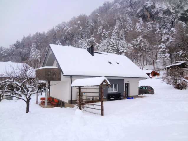 Exterior of Apartments Fine Stay blanketed with a layer of snow as Slovenia received its first snow in winter 2020-21