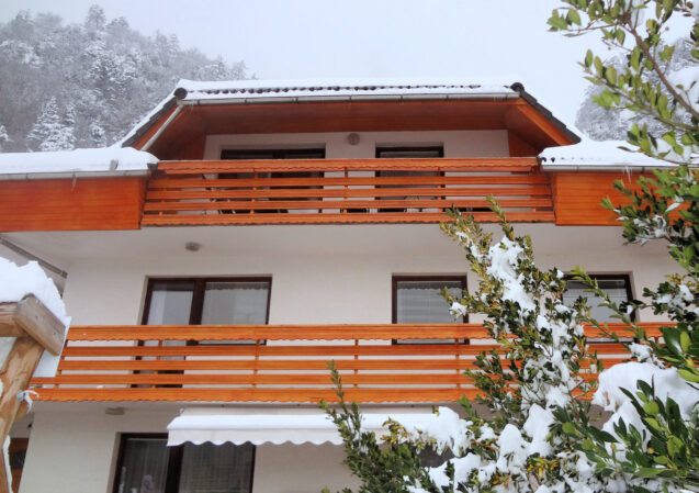 Exterior of Apartments Fine Stay blanketed with a layer of snow as Slovenia received its first snow in winter 2020-21