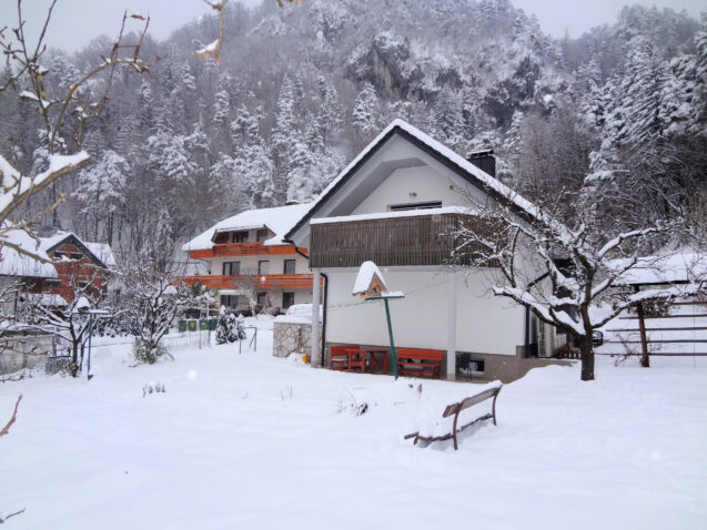 Exterior of Apartments Fine Stay blanketed with a layer of snow as Slovenia received its first snow in winter 2020-21