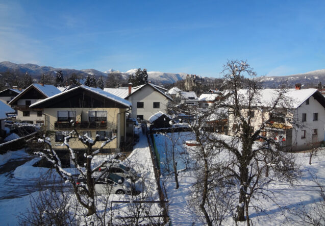 View of Bled Castle from the Loft Apartment at accommodation Apartments Fine Stay Bled in Winter