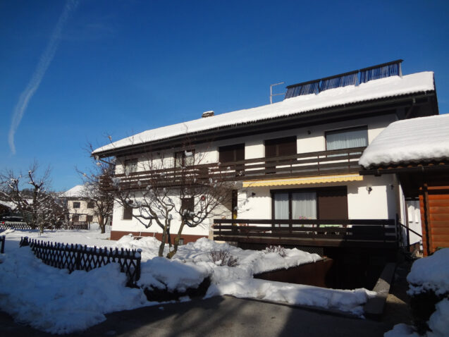 Accommodation Apartments Fine Stay Bled in Slovenia covered in snow in winter