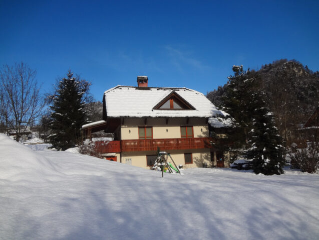 Exterior of accommodation Apartments Valant Bled in Slovenia covered in snow in winter
