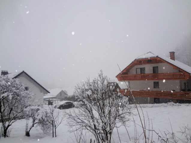 Exterior of accommodation Apartments Fine Stay in the Bled area of Slovenia during a snowfall